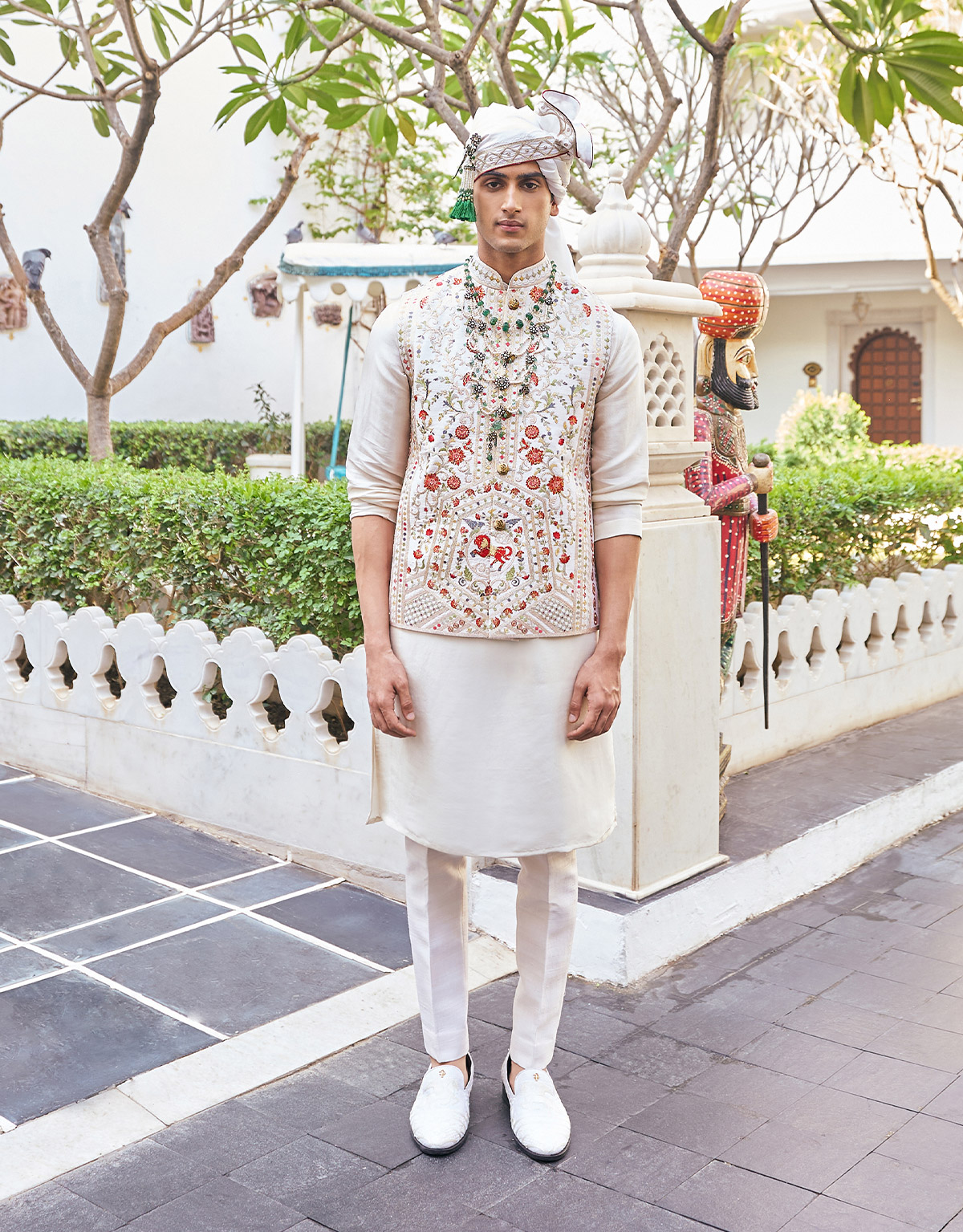 ivory silk kurta with an intricately embroidered bandi