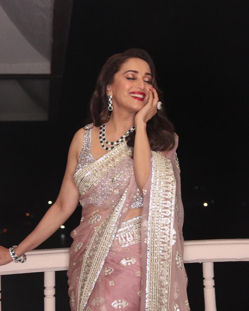 sported a pink, adorned saree by Falguni Shane Peacock
