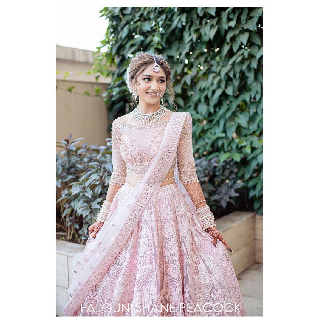 FSP bride Diksha Patel made a vision of a bride in the light pink Falguni Shane Peacock Lehenga