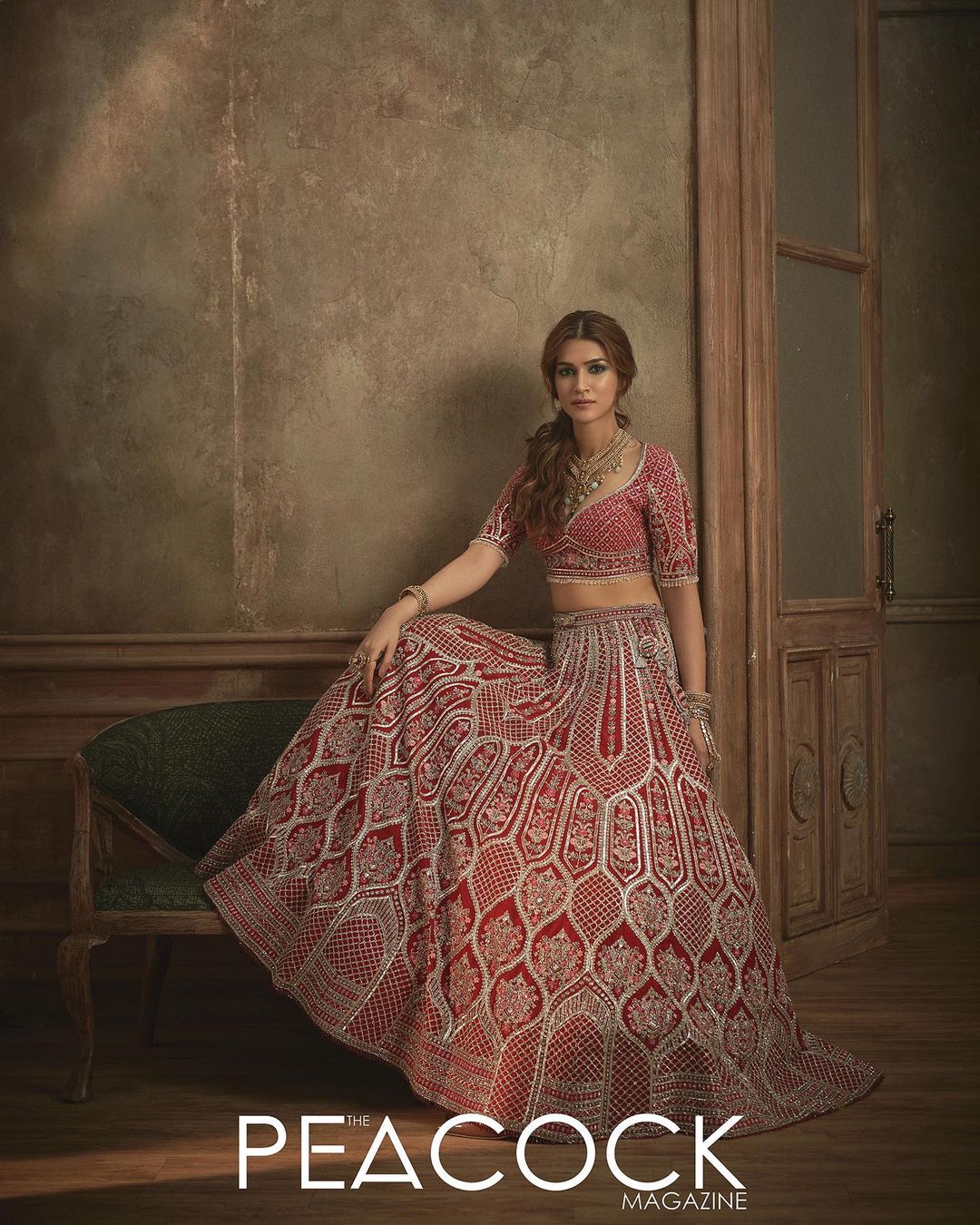 Sanon sports a royal red Indian Lehenga detailed with ethnic arch motifs