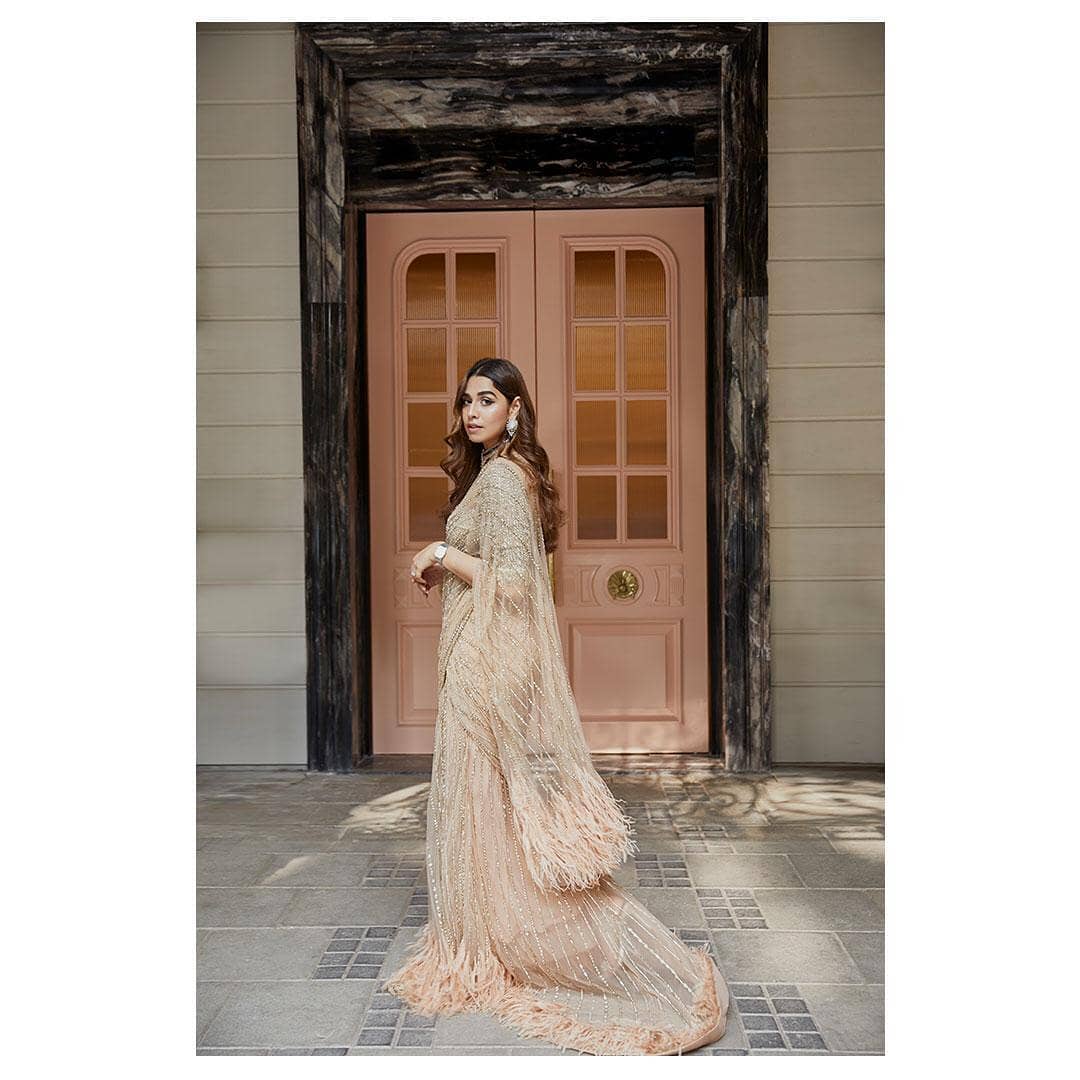 Summiya Shah in a champagne gold saree gown by Falguni Shane Peacock