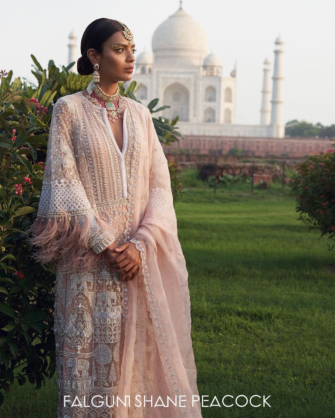 the Kurta is created in the soft hue of dusty rose-pink based ivory Kurta set
