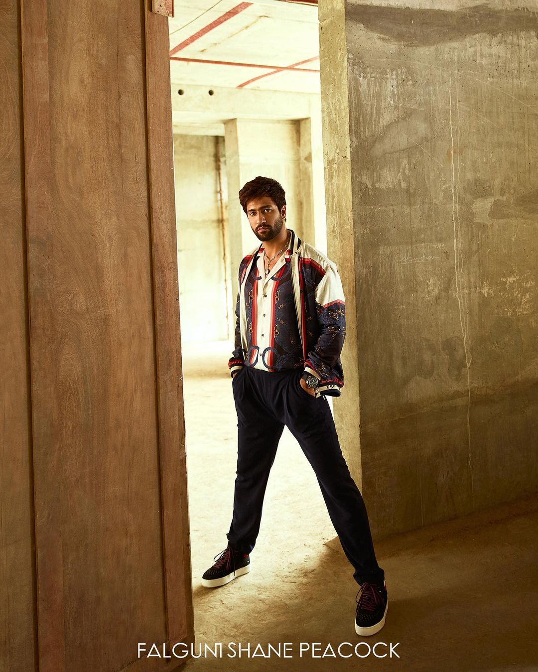 multicolored shirt along with a bomber jacket of the very print.