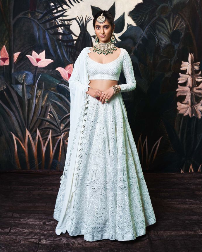 An ivory Indian Lehenga by Falguni Shane Peacock