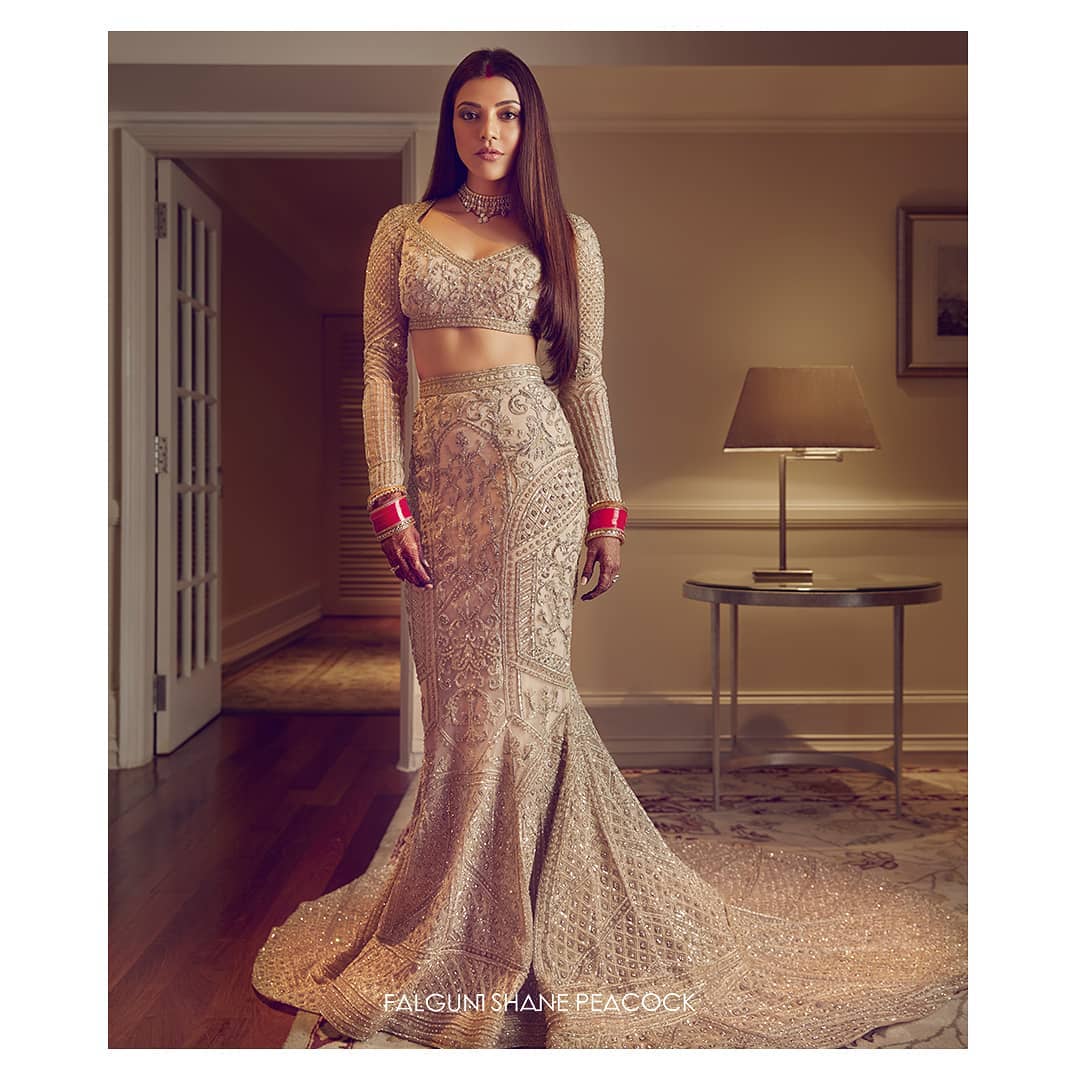 Kajal Agarwal’s champagne gold, fitted, trail Lehenga
