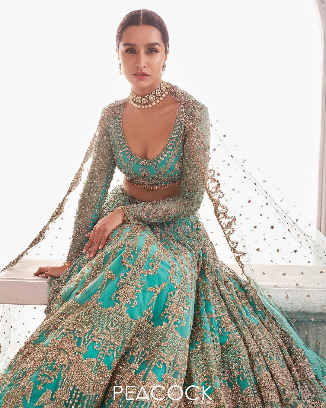 Shraddha Kapoor in a peach trail Lehenga by Falguni Shane Peacock