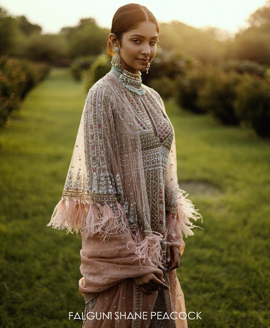 The Kurta is teamed with a tulle Dupatta