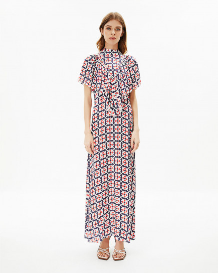 long designer dress features frontal shoulder frills and a high neck-line