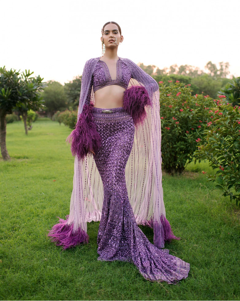 MAUVE-BASED, PURPLE, FITTED, TRAIL LEHENGA REPLETE WITH SEQUINS DETAILING.