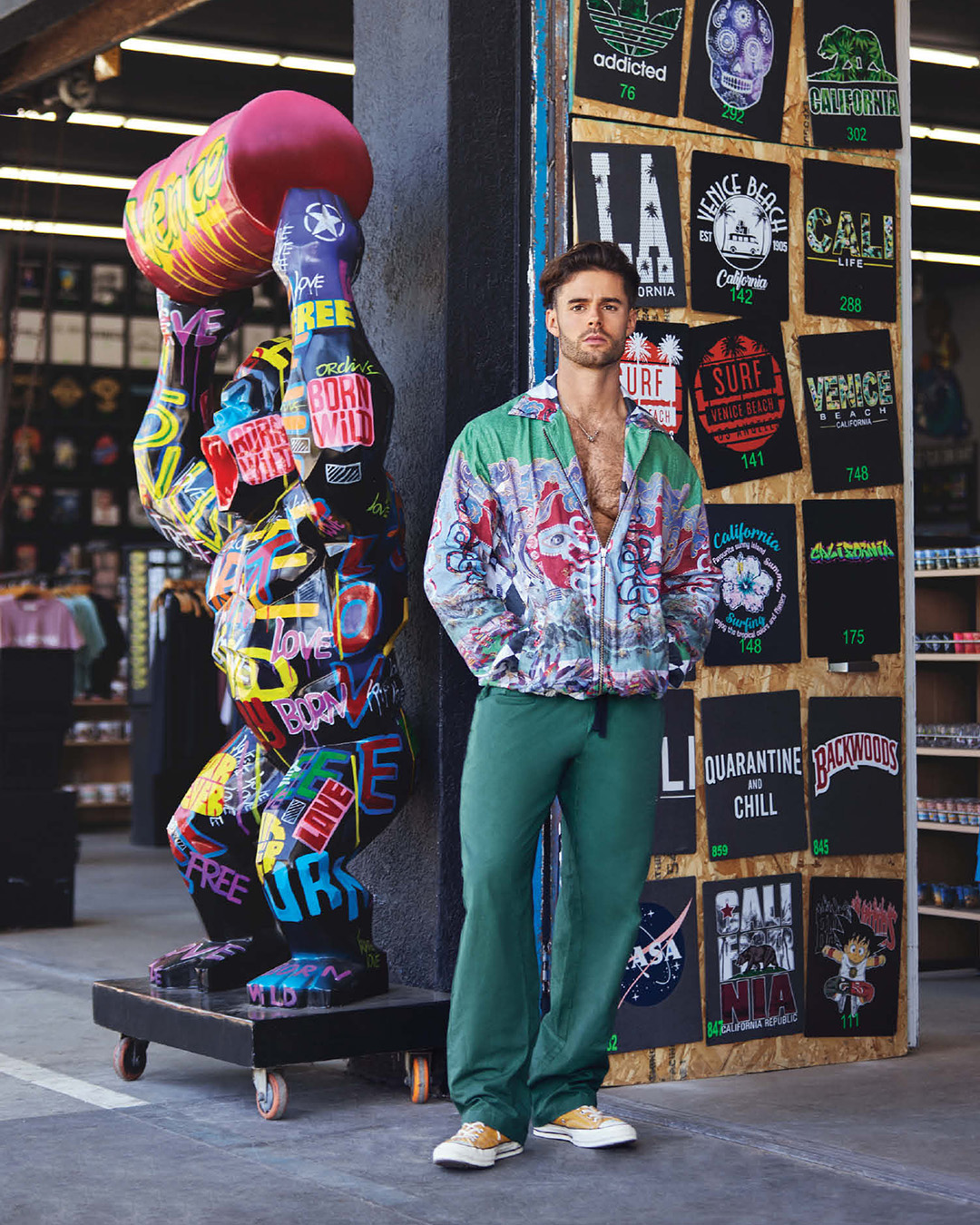 Abstract printed bomber jacket, paired with a pair of green trousers 