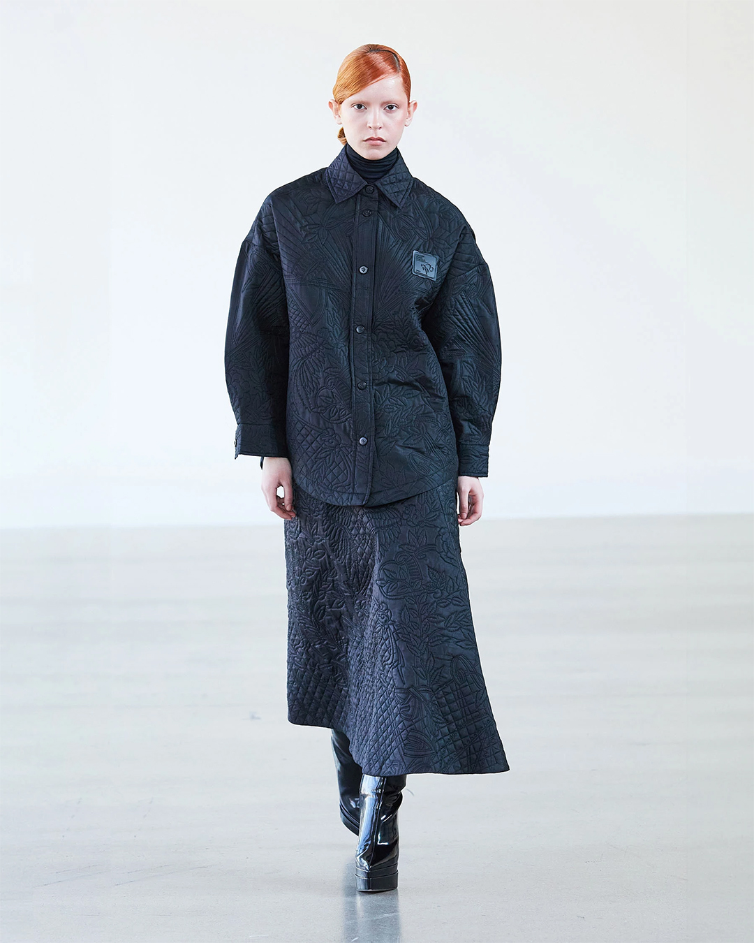 Black monogrammed jacket with skirt