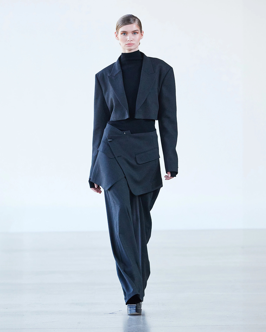 Black turtleneck sweater with grey blazer and pants