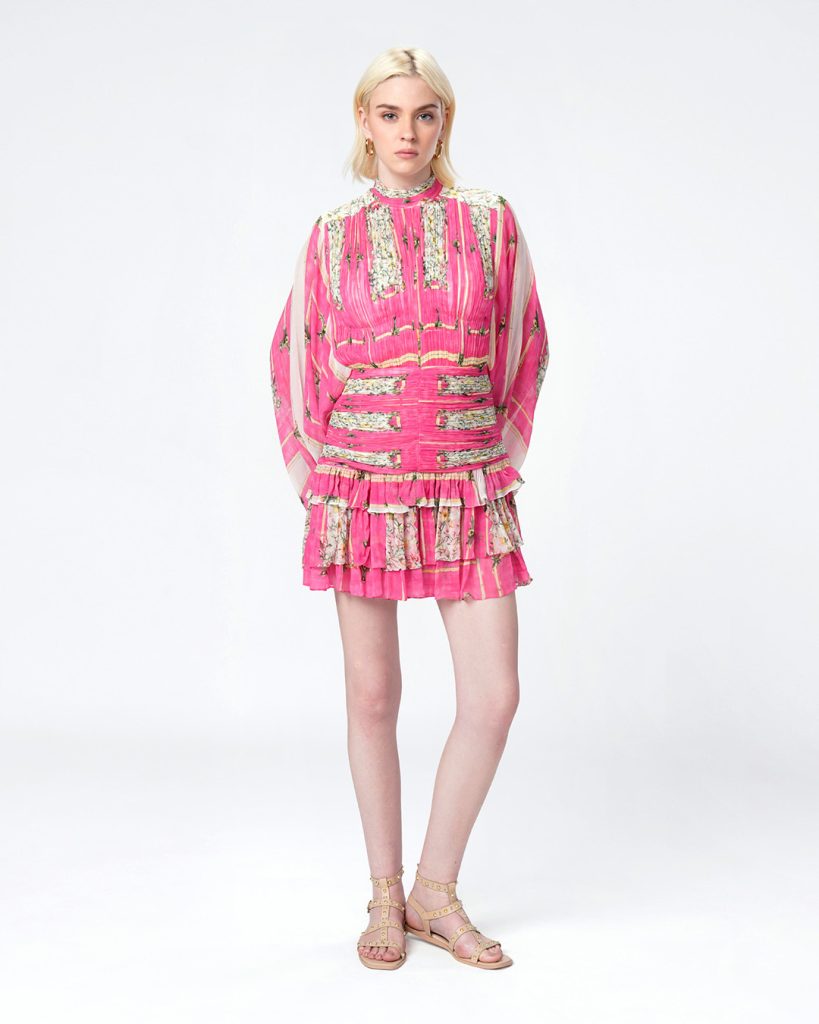 Woman in patterned dress with architectural illustrations