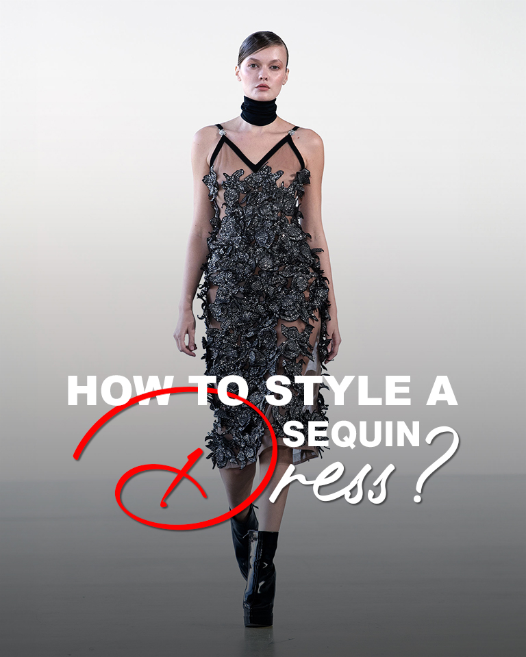 Model walking in a black sequin dress with style a sequin dress